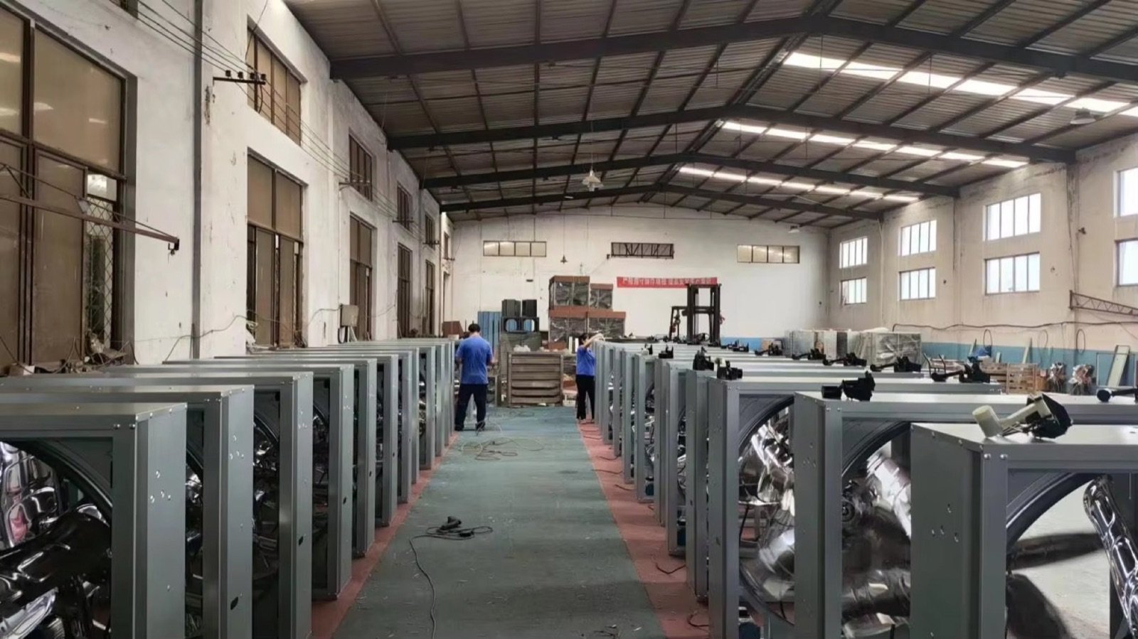 Fan assembly workshop with units arranged in rows