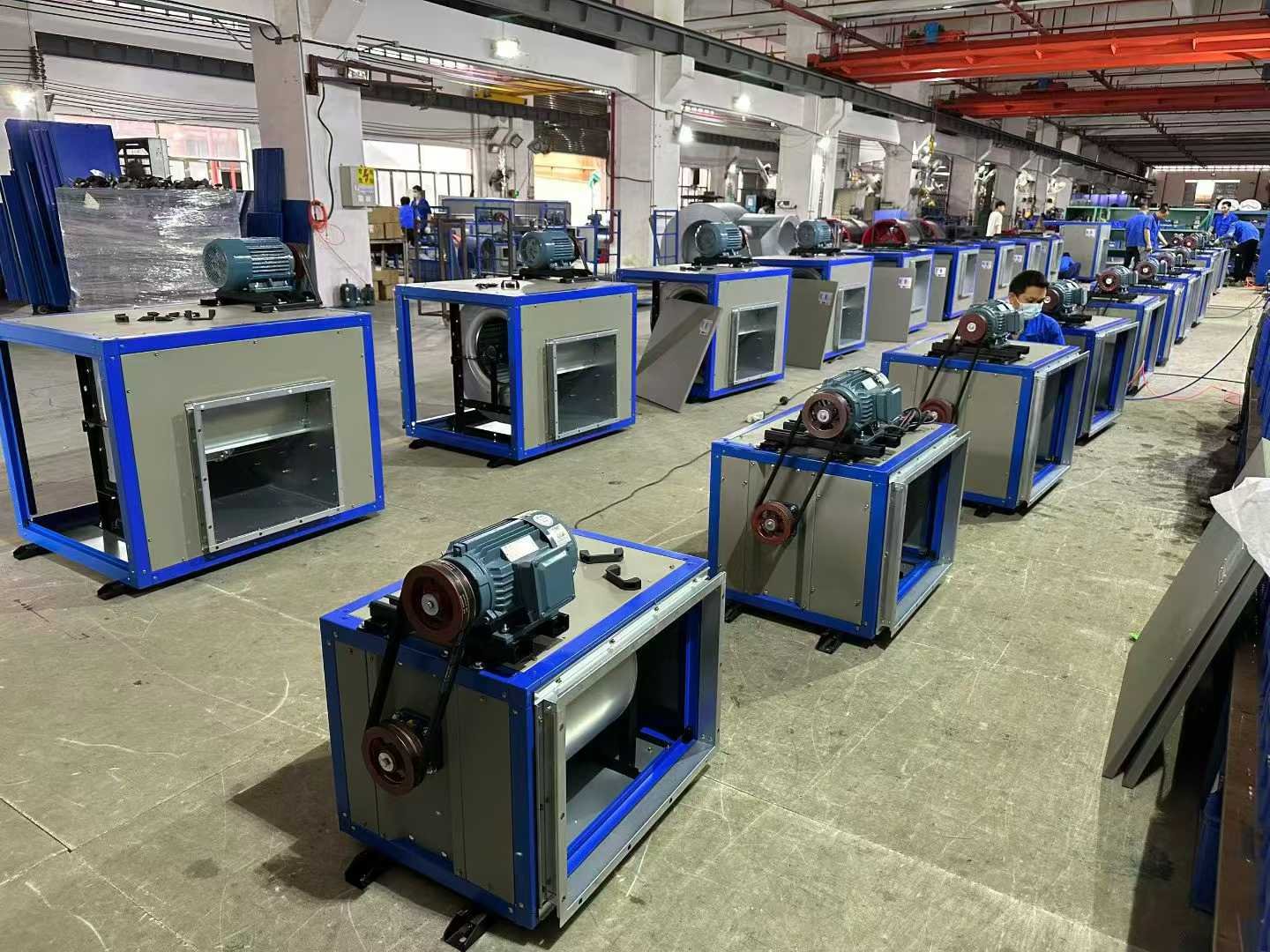 Belt-driven air handling units on an assembly line